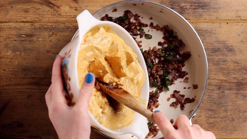 Add cod in sauce to fried onions Add cod in sauce to fried onions